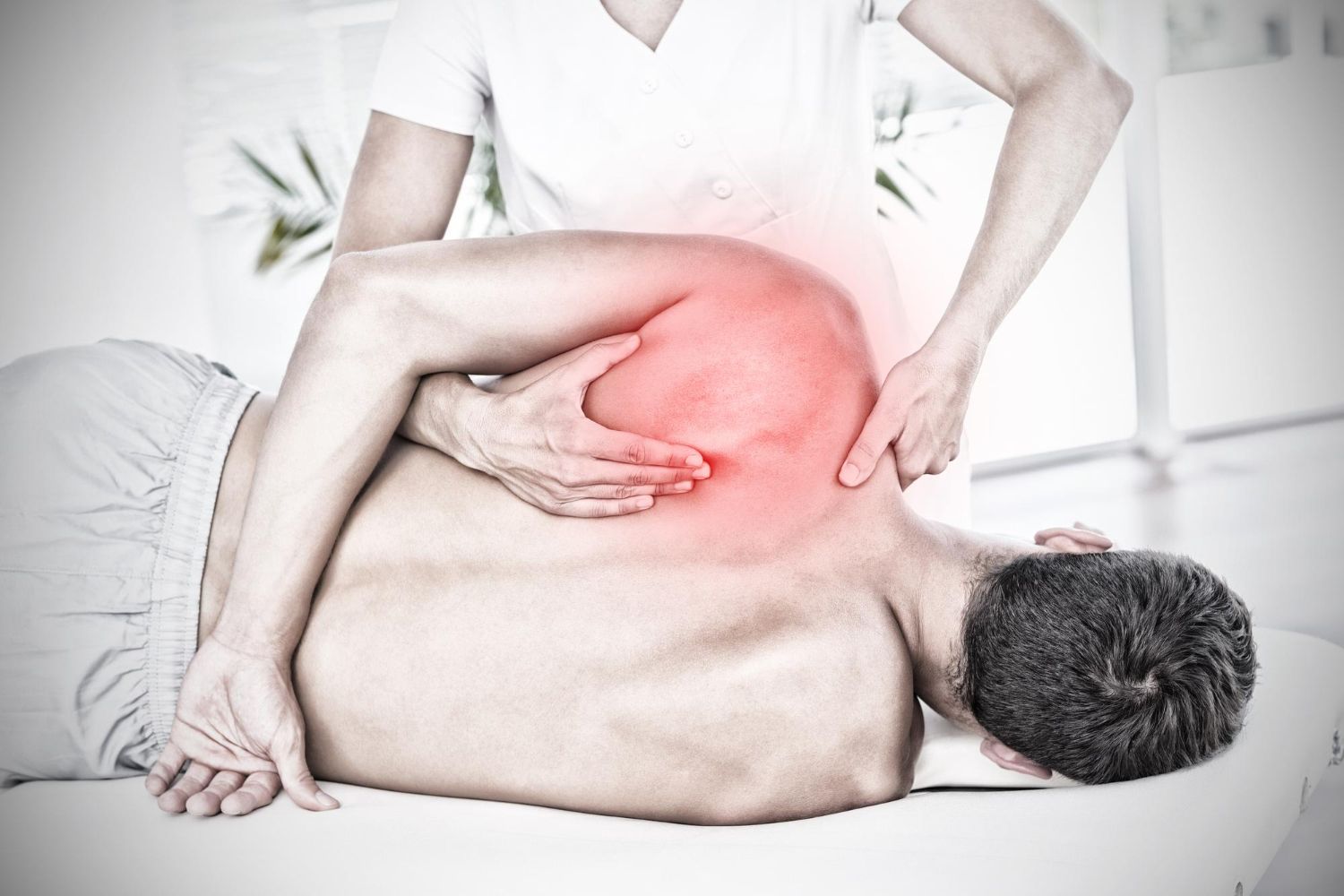 highlighted-pain-against-physiotherapist-doing-back-massage-her-patient image